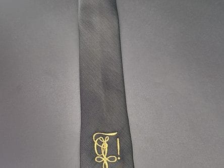 Krawatte mit goldenen Zirkel bestickt